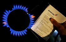 FILE - A British Gas bill is displayed by a gas ring on a cooker in this photo illustration in London, Thursday, Feb. 21, 2008. 