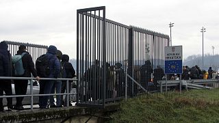 People wait in line on the border crossing Maljevac, between Bosnia and Croatia, Tuesday, Dec. 27, 2022.