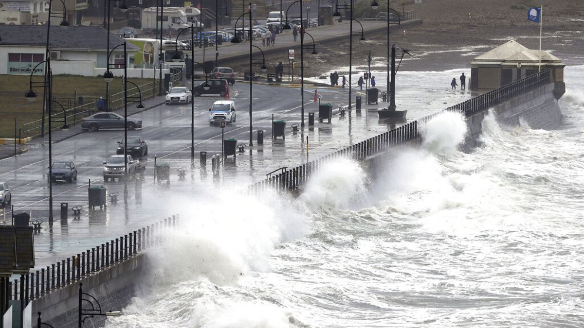 Waves crash into the seafront at Tramore in County Waterford, on the southeast coast of Ireland, εικόνα αρχείου