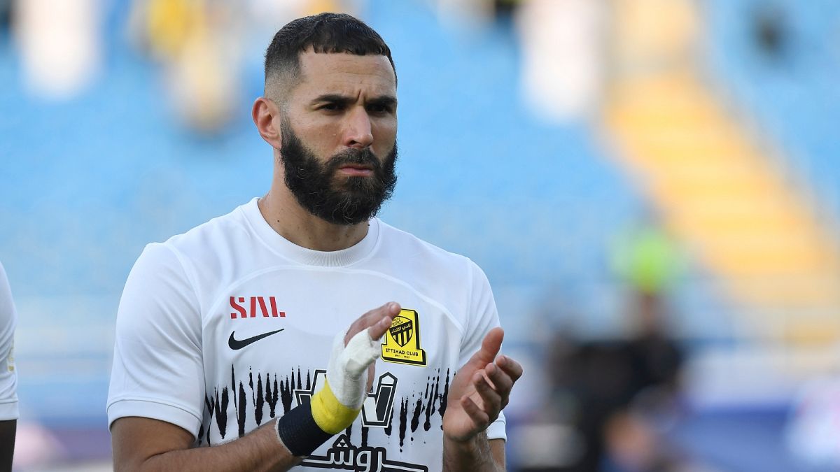 Al Ittihad's Karim Benzema greets fans during his team match against Al Raed in the Saudi Professional League, in Buraidah, Saudi Arabia, Monday, Aug. 14, 2023.