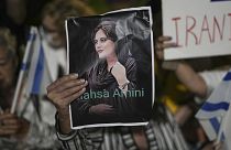 Women attend a protest against the death of Mahsa Amini, a woman who died while in police custody in Iran, during a rally in Tel Aviv, Oct. 29, 2022. 