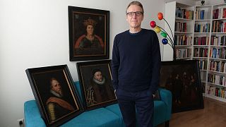 Dutch art detective Arthur Brand, dubbed the "Indiana Jones of the Art World", with six paintings he has recovered, including a portrait of William of Orange