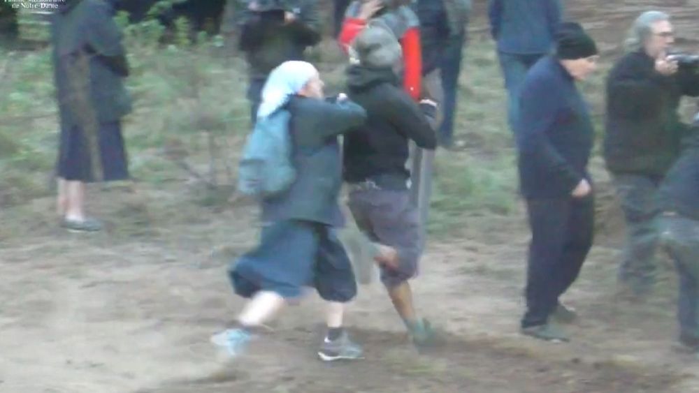 Nun rugby tackles environmental activist as protest over new church turns violent thumbnail
