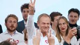 Poland's main opposition leader, former premier and head of the Civic Coalition bloc, Donald Tusk addresses supporters at the party's headquarters in Warsaw, on October 15.