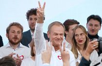Poland's main opposition leader, former premier and head of the Civic Coalition bloc, Donald Tusk addresses supporters at the party's headquarters in Warsaw, on October 15.