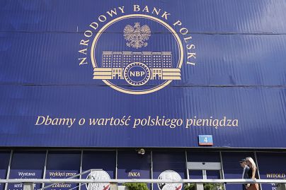 A banner on the building of the National Bank of Poland says, "We protect the value of the Polish currency," in Warsaw, Poland, on September 7.