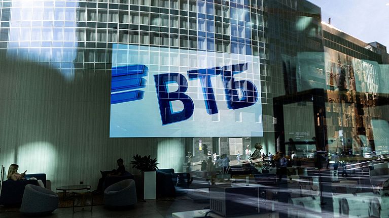 A VTB bank logo is seen on screen through a window in the Moscow International Business Center, also known as Moscow-City, on a sunny day in Moscow, Russia August 12, 2022. A VTB bank logo is seen on screen through a window in the Moscow International Business Center, also known as Moscow-City, on a sunny day in Moscow, Russia August 12, 2022.