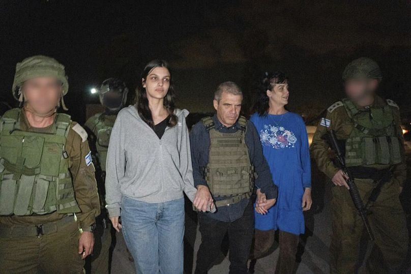 In this photo provided by the Government of Israel, Judith Raanan (R) and her 17-year-old daughter Natalie are escorted by Gal Hirsch, special coordinator for hostage return