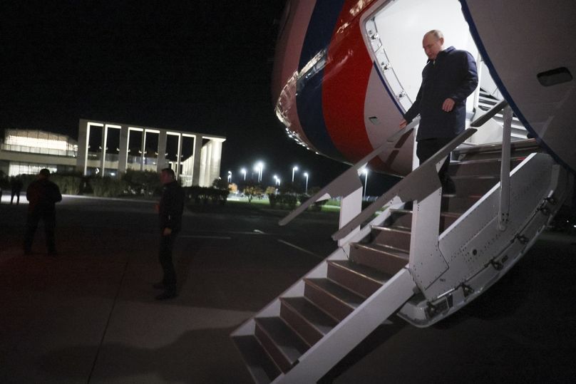 Russian President Vladimir Putin steps down the stairs upon his arrival in Rostov-on-Don, October 2023