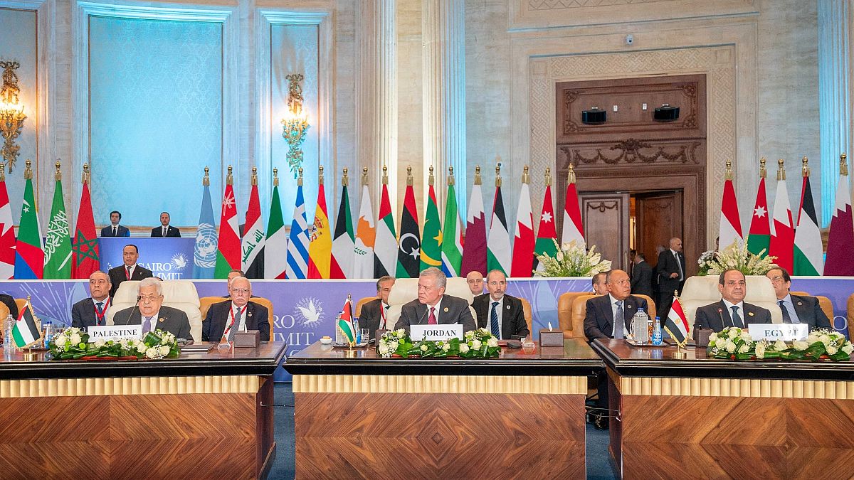 Egyptian President Abdel-Fattah al-Sisi (R), Jordanian King Abdullah II (C) and Palestinian President Mahmoud Abbas (L) attend The Cairo Peace Summit 
