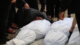 A Palestinian mourns over the body of a relative after overnight Israeli strikes on Rafah in the southern Gaza Strip on Sunday