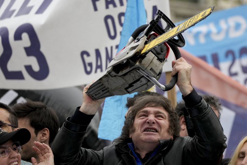 Presidential hopeful of the Liberty Advances coalition Javier Milei brandishes a chainsaw during a campaign event in La Plata, 12 September 2023