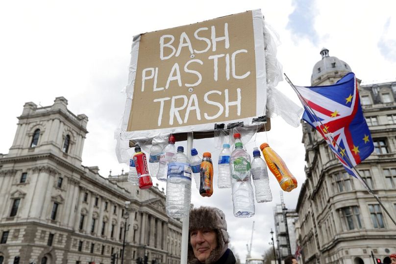 A man takes part in a protest outside the House of Parliament in London, March 2019