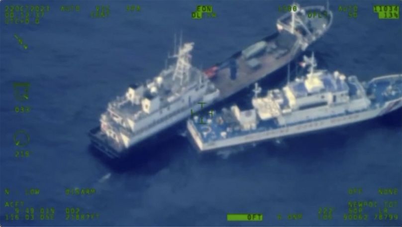 Chinese militia vessel, top, and Philippine coast guard vessel BRP Cabra as they approach Second Thomas Shoal,