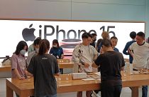 Customers experience iPhone 15 at an Apple store in Shanghai, China, October 7, 2023.