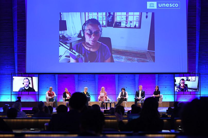 Yvonne Muinde speaks via video call at the UNESCO AI conference in Paris