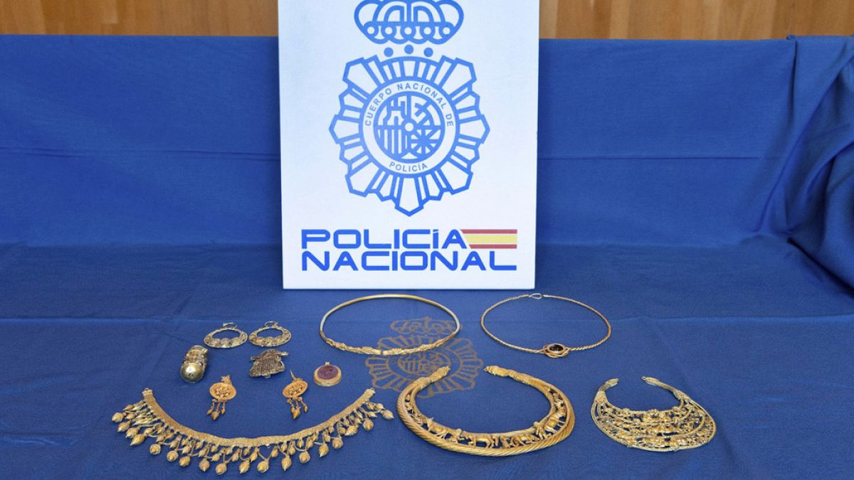 Pieces of ancient gold jewellery are displayed after being recovered by Spanish police