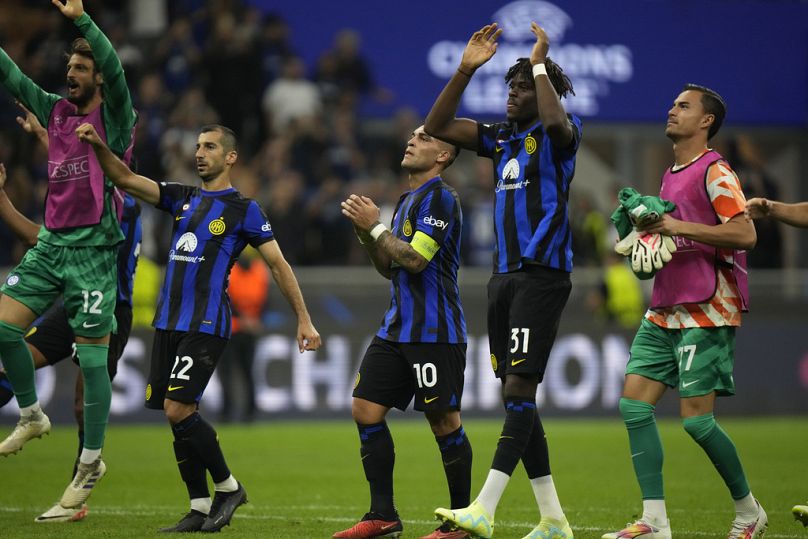 Inter Milan players applaud fans at the end of the Champions League, Group D soccer match between Inter Milan and Benfica, at the San Siro stadium Tuesday, Oct. 3, 2023.