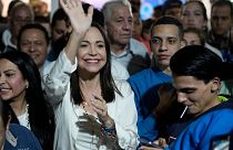 Opposition presidential hopeful Maria Corina Machado celebrates with supporters in Caracas.