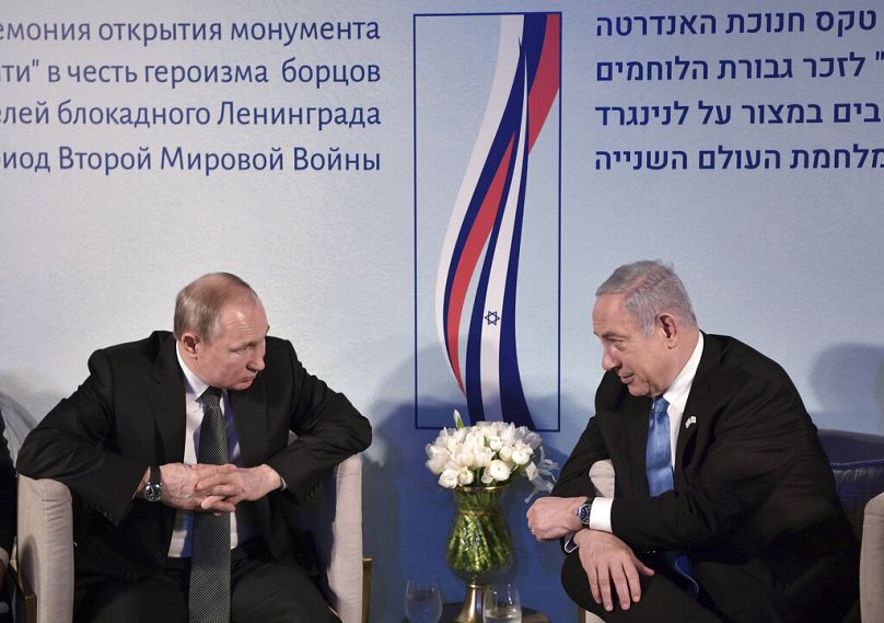 Russian President Vladimir Putin and Israeli Prime Minister Benjamin Netanyahu attend an unveiling ceremony of the Remembrance Candle monument in Jerusalem, January 2020