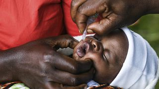 A baby receives an oral polio vaccine during the Malawi Polio Vaccination Campaign Launch in Lilongwe, Malawi, on March 20, 2022.