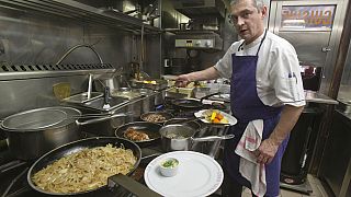 Chef Thierry Laurent prepares the plates in the kitchen of Bistro Paul Bert in the trendy 11th arrondissement of Paris, 2014.