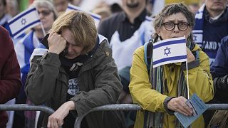 A woman cries as she listens to speeches during a demonstration against antisemitism and to show solidarity with Israel in Berlin, Germany, Oct. 22, 2023.