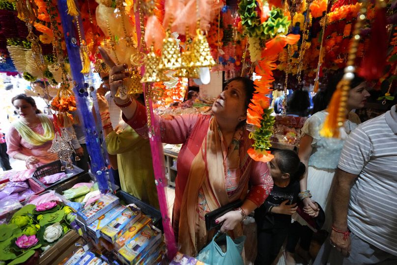 People shopping on the eve of Diwali.