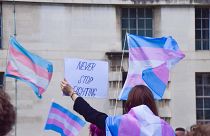 A trans rights protester takes to the streets of London