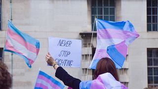 A trans rights protester takes to the streets of London