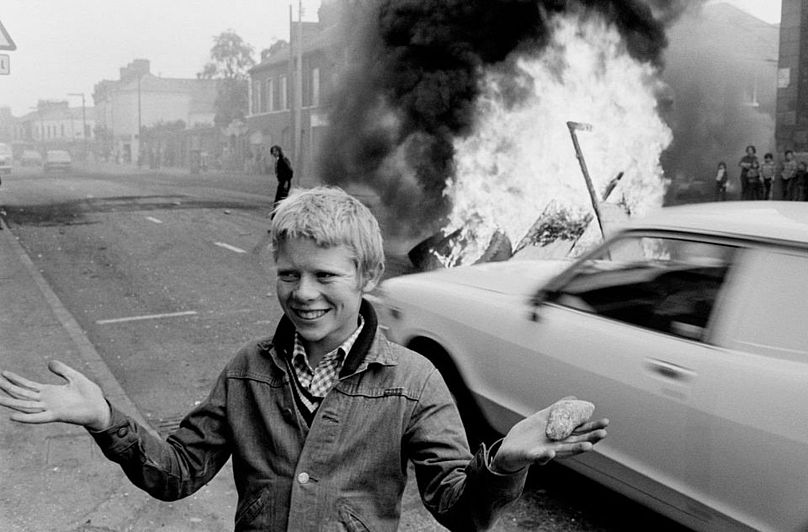 Youth with a stone during a riot at the top of Leeson Street, west Belfast, 1978.