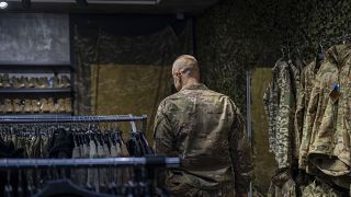 A soldier attends a military shop in Kramatorsk, Ukraine, Wednesday, Sept. 13, 2023.