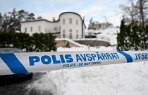 Police tape cordons an area outside a house where Swedish Security Service arrested two people on suspicions of espionage in a predawn operation in Stockholm, November 2022.