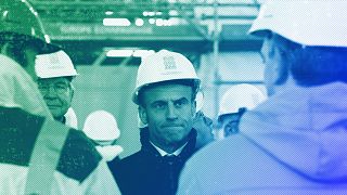 French President Emmanuel Macron wearing a worker's helmet in Paris, April 2023