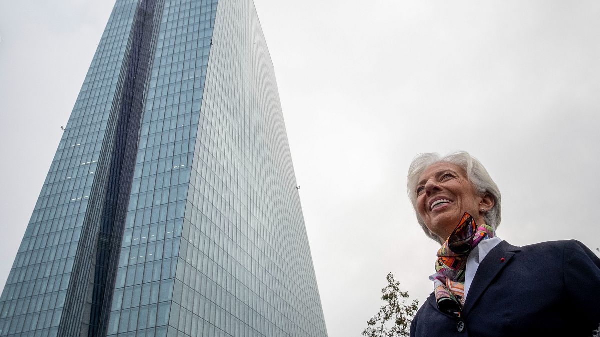 President of European Central Bank Christine Lagarde talks to media people in front of the ECB building before she takes office in Frankfurt, Germany in 2019