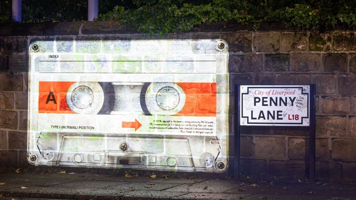 A mysterious cassette tape is being projected onto several "Beatles locations"