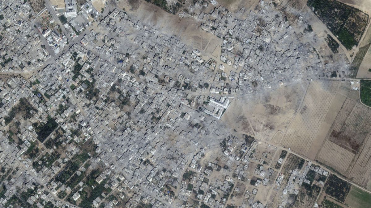 This image provided by Maxar Technologies shows damage to buildings and structures in the neighborhood after bombing at Beit Hanoun, northern Gaza.