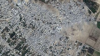 This image provided by Maxar Technologies shows damage to buildings and structures in the neighborhood after bombing at Beit Hanoun, northern Gaza.