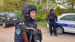 Serbian police officers by the side of the road
