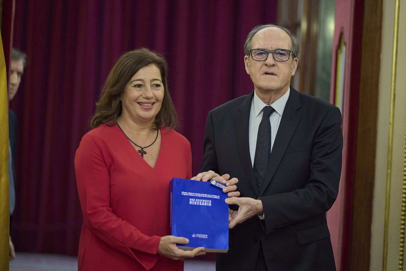 Spanish Ombudsman Angel Gabilondo, right, delivers a report from the country's first independent probe into the abuse of minors within the Catholic Church.