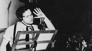 Orson Welles broadcasts his radio show of H.G. Wells' science fiction novel "The War of the Worlds" in a New York studio at 8 p.m., Sunday, Oct. 30, 1938.