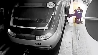 FILE - In this image from surveillance video aired by Iranian state television, women pull 16-year-old Armita Geravand from a train on the Tehran Metro, October 1st 2023