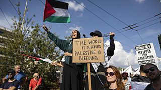 Pro Palestinian protesters take part in a rally outside the Israeli embassy in Athens, Greece, Sunday, Oct. 29, 2023.