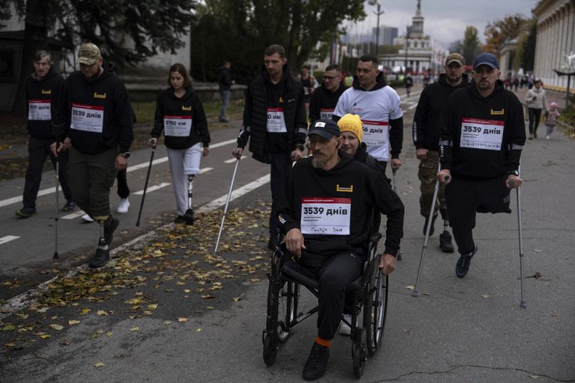 Ukrainian veterans of the war participate in a one-kilometre race in Kyiv, Ukraine, Sunday, Oct. 29, 2023.