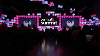 Attendees take their seats at center stage before the opening of the Web Summit technology conference in Lisbon, Monday, Nov. 5 2018.