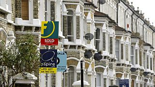 Estate agents' boards are seen in south London, Tuesday Feb. 17, 2009. British homeowners are returning to the property market looking to pick up bargains following recent hou