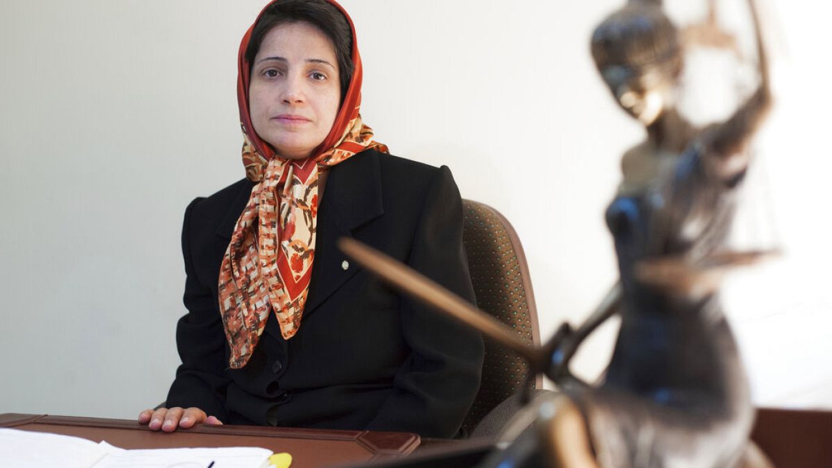 FILE: In this Nov. 1, 2008 photo, Iranian human rights lawyer Nasrin Sotoudeh, poses for a photograph in her office in Tehran, Iran.