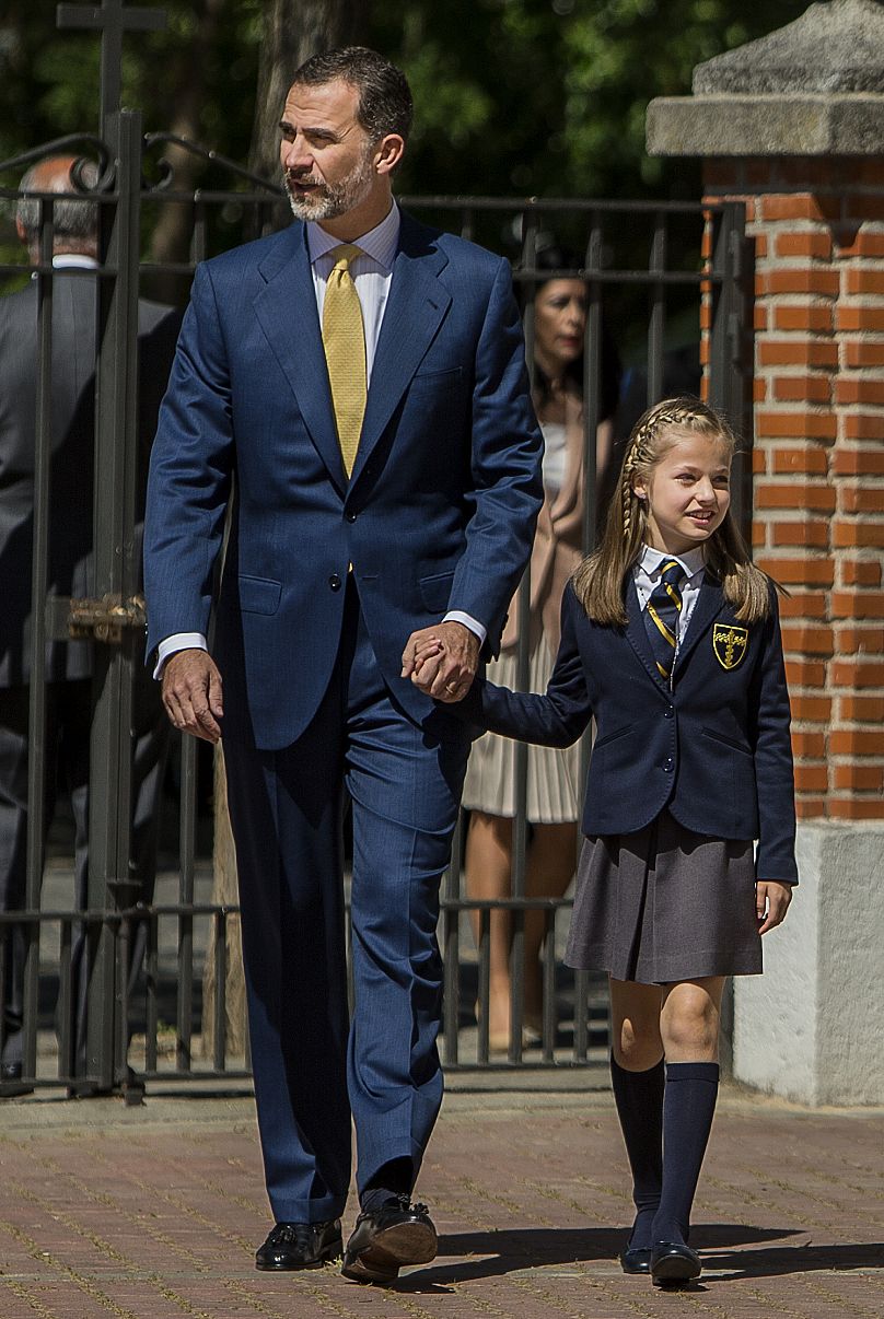 Spain's King Felipe VI, left, and Crown Princess Leonor, right, arrive during her first communion in Madrid, Spain, Wednesday, 20 May 2015.