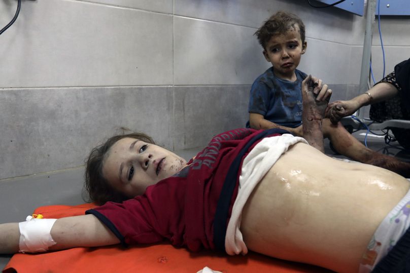 Wounded Palestinian children receive treatment at the al-Shifa hospital, following Israeli airstrikes on Gaza City, Thursday, Oct. 26, 2023.