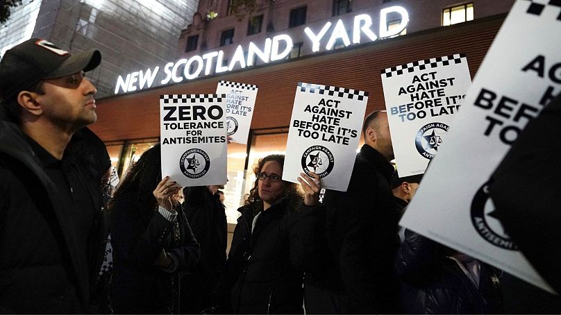 People attend a Campaign Against Antisemitism rally outside New Scotland Yard in central London, seeking police action amid a rise in antisemitic incidents on Oct. 25.